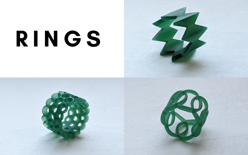 Rings: ring with a triangle/elongated diamond pattern filed in, ring with 3 rows of holes burred in, ring with interlocking circles. ALl made from green wax