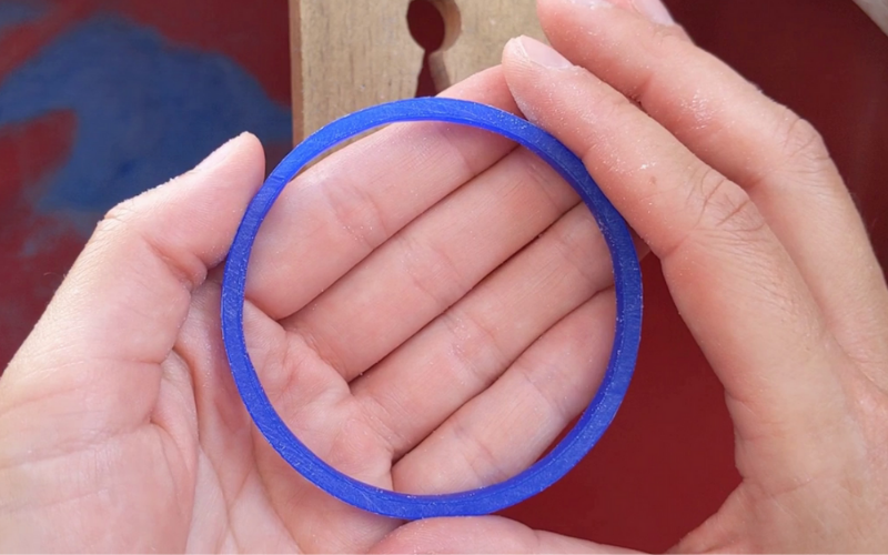 plain round bangle before details get added in blue wax