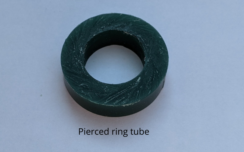 Green ring tube that has just been pierced