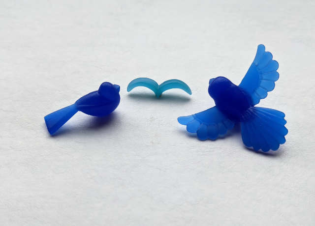 3 wax carved bird pendants. One super simple flying bird outine, one generic bird shape, one more complicated bird with detailed spread wings