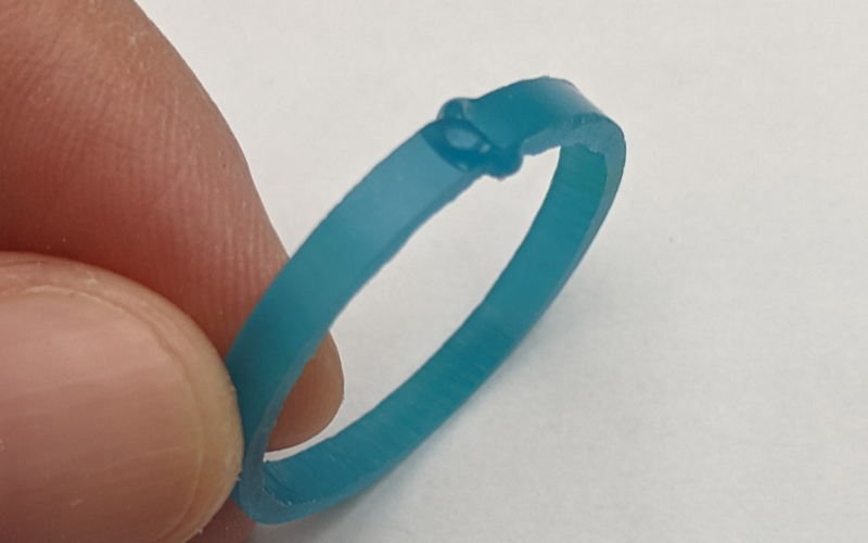Turquoise wax ring with blobs of wax over a break