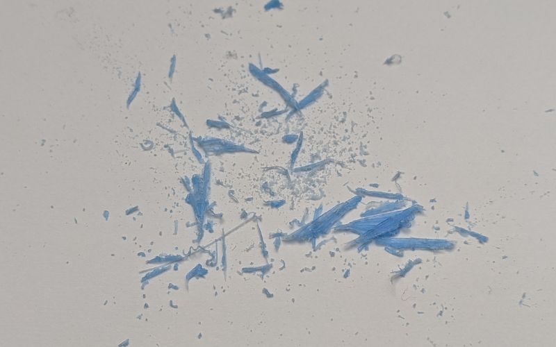 Blue wax dust from piercing