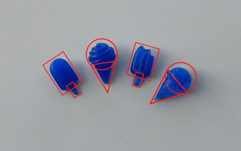 4 ice cream charms from blue wax with red boxes around them to show what base shapes they're made off. Ice lollies are rectangles, soft serve and single scoop are a rectangle with a circle on top 