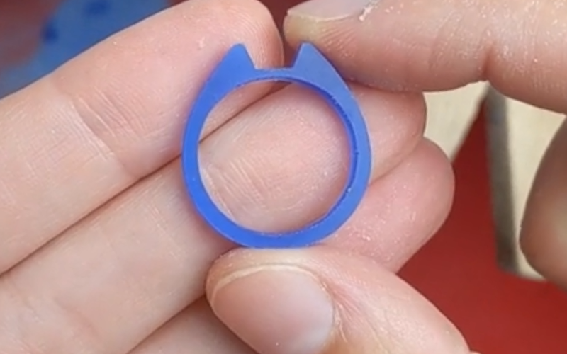 Close up of blue wax ring. In the middle is a little cutout where a setting can fit