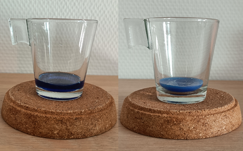 2 side by side photos. Left small glass with liquid blue wax on top of a coaster, right same glass but the liquid wax is now solidified