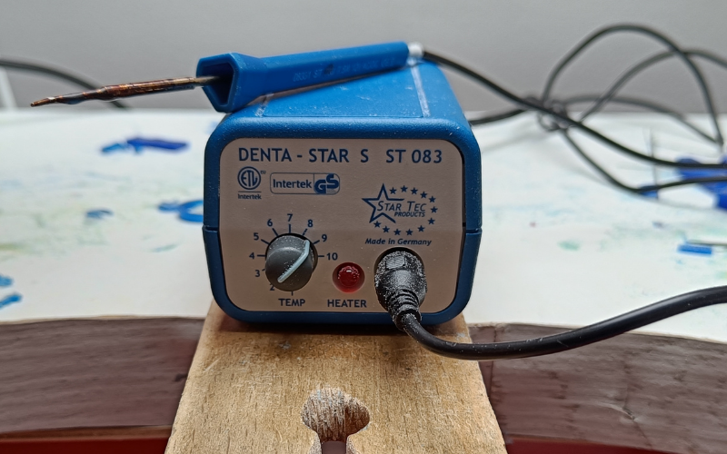 Close up of a dentastar wax melting system on a bench peg