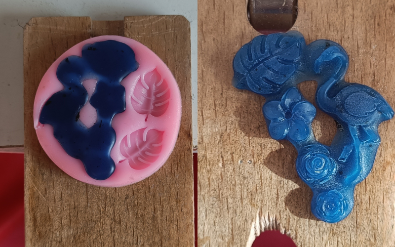 2 photos side by side. Left polymer clay mould filled with blue wax. The wax is spilling out if the openings. Left the wax imprint out of the mould. The leaf and flowers look good but the flamingo neck didn't fill with wax completely