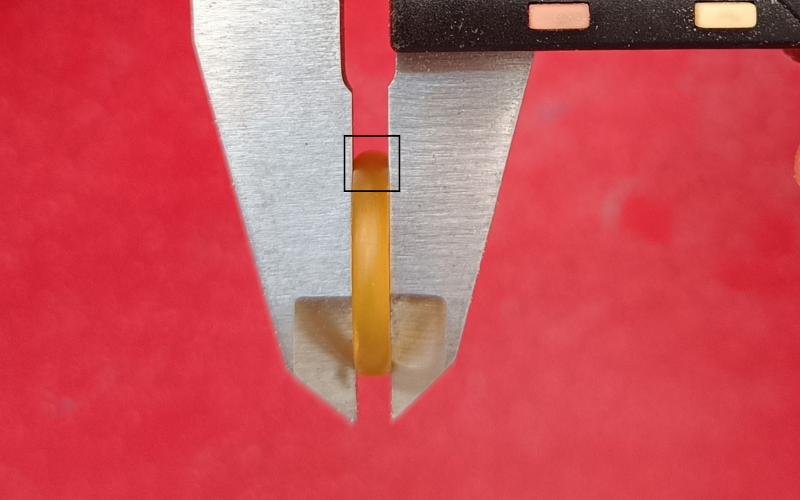 Close up of a court shaped wax ring in the jaws of the calipers. A black box is drawn around the part you are focussing on. The focus point is at the top where you can check if the curve is symmetrical