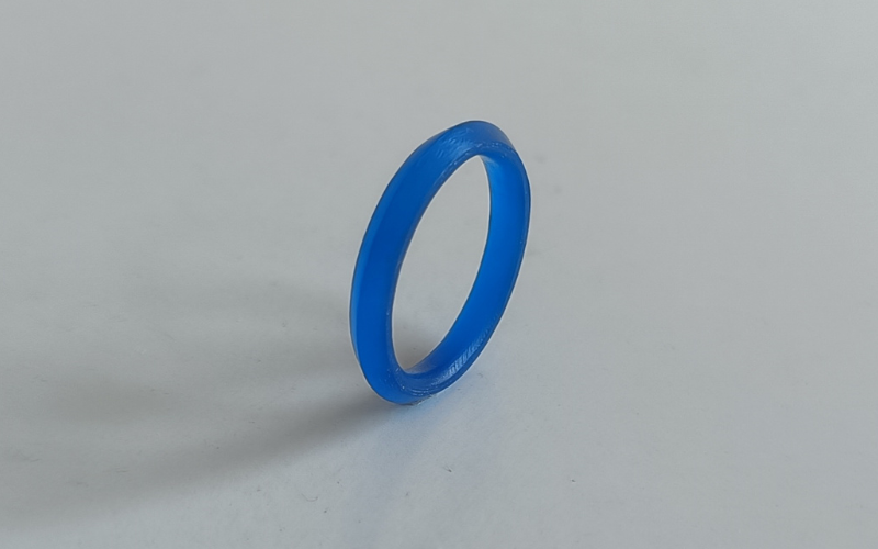 A blue wax ring with a knife edge