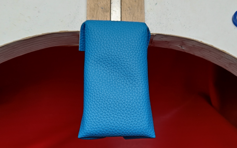 Bench peg wrapped in blue leatherette