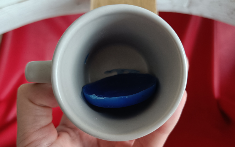 Close up of mug with blue wax slice inside