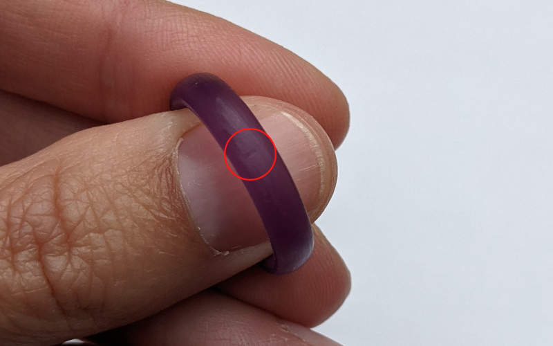 Purple wax ring with a small mark from a needle file