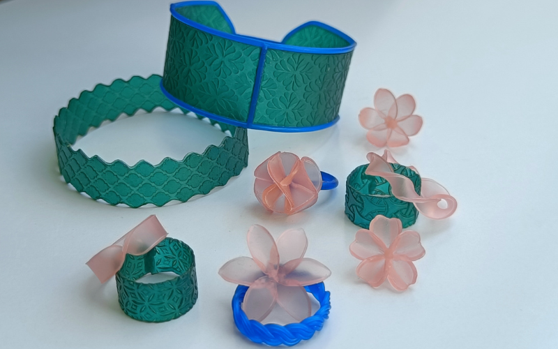 Variety of pieces made from green and pink sheet wax and blue wire wax. 2 bangles, some flower pieces and rings