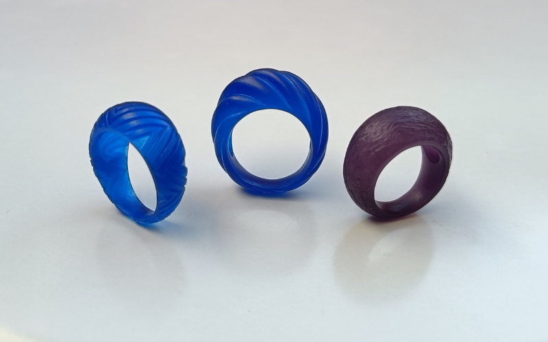 3 bombe rings in wax. One has a triangular pattern cut out, one has a rope pattern filed in and one has a rough texture