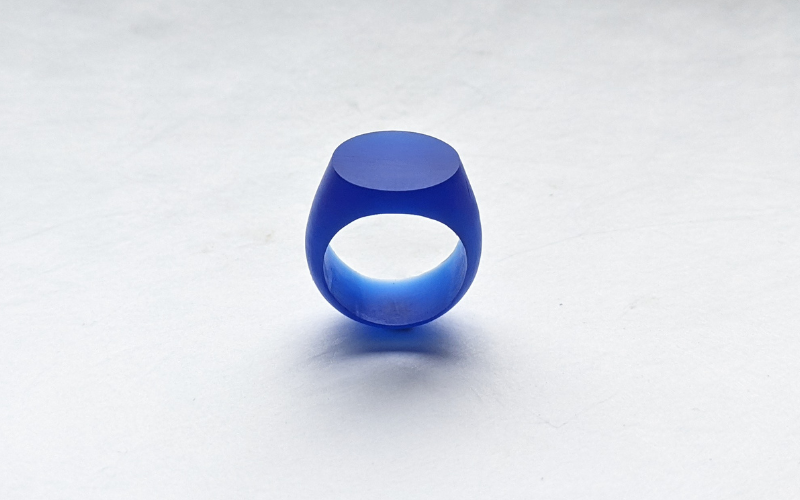 Round signet ring from blue wax. You can see that the shank is curved