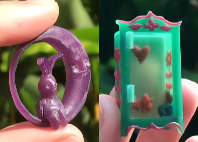 Side by side photos. Left fingers holding a piece of round purple waxed carved as a moon with a hare sitting inside. Right fingers holding a closet made from green wax you can see detailing in red wax on the side and back through the wax
