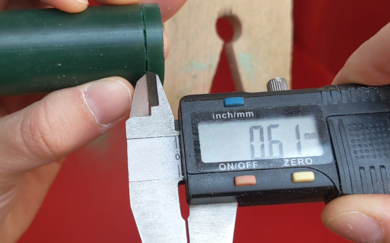 Callipers measuring a .61mm gap on a wax ring tube