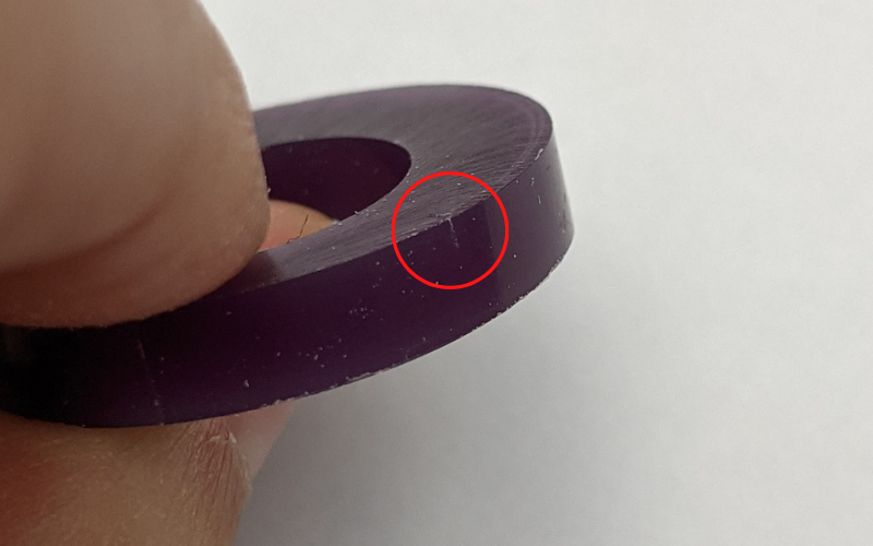 Close up of purple ring with the mark the stanley knife left