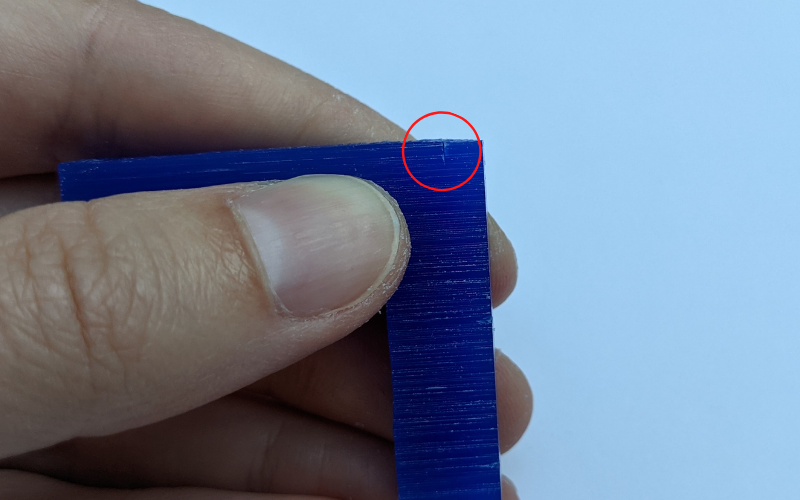 Blue piece of wax with stanley knife mark