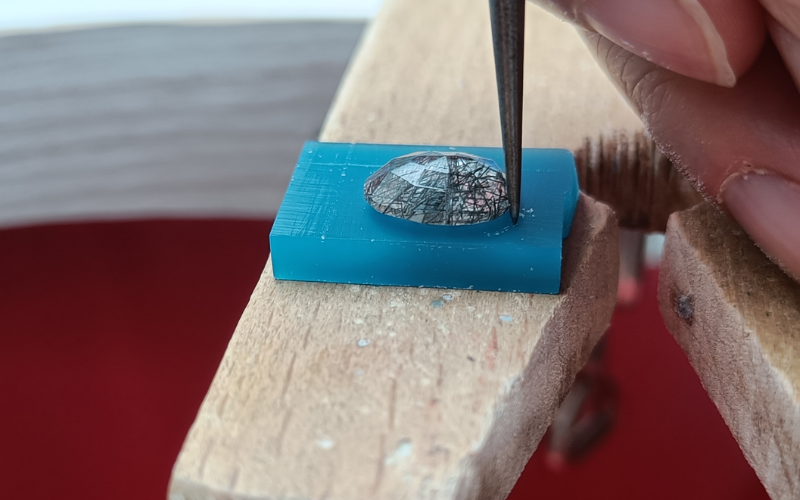 stone on wax with a scribe running along the side to mark the outline on wax